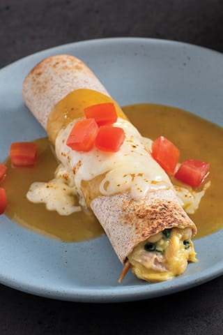 CHICKEN AND WHITE BEAN ENCHILADAS MADE WITH CAMPBELL’S® HEALTHY REQUEST® CREAM OF CHICKEN SOUP